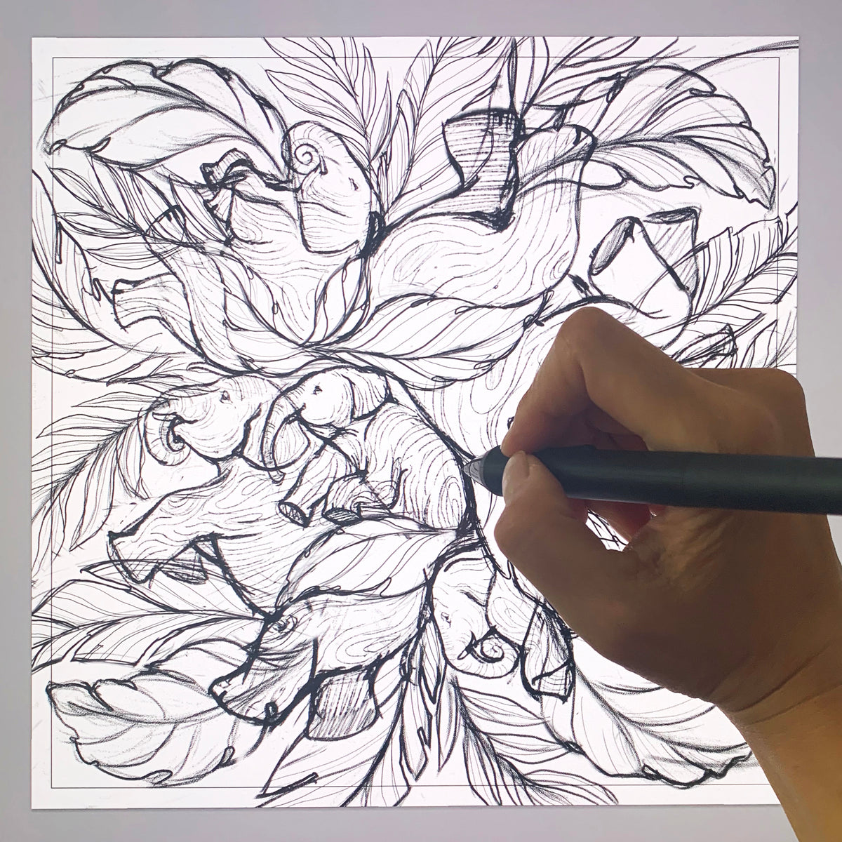 Hand drawing an intricate design of napping elephants surrounded by lush leaves, perfect for canvas bag artwork.