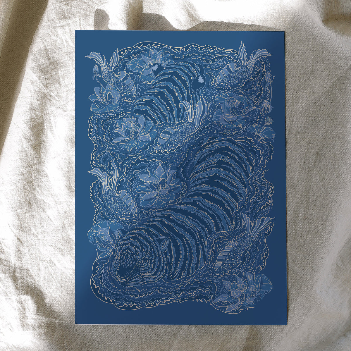 Blue and white intricate design of a tiger on a textured fabric background