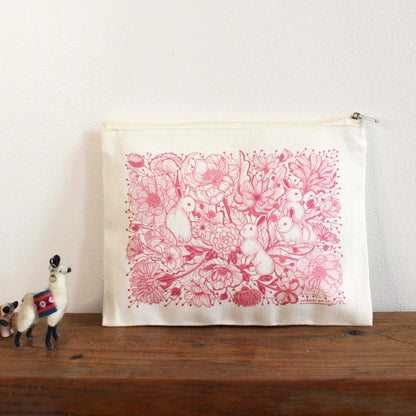 Canvas zipper pouch with floral bunny design, perfect for cosmetics, pencils, or coins.