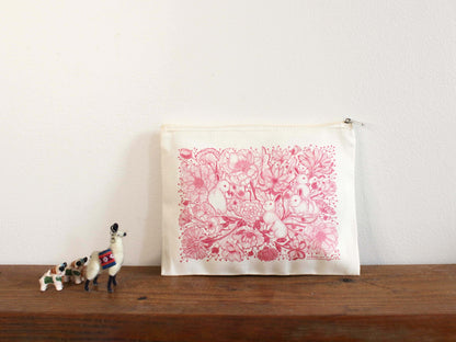 Bunny in the Floral Breeze canvas zipper pouch featuring floral bunny art on a neutral background.