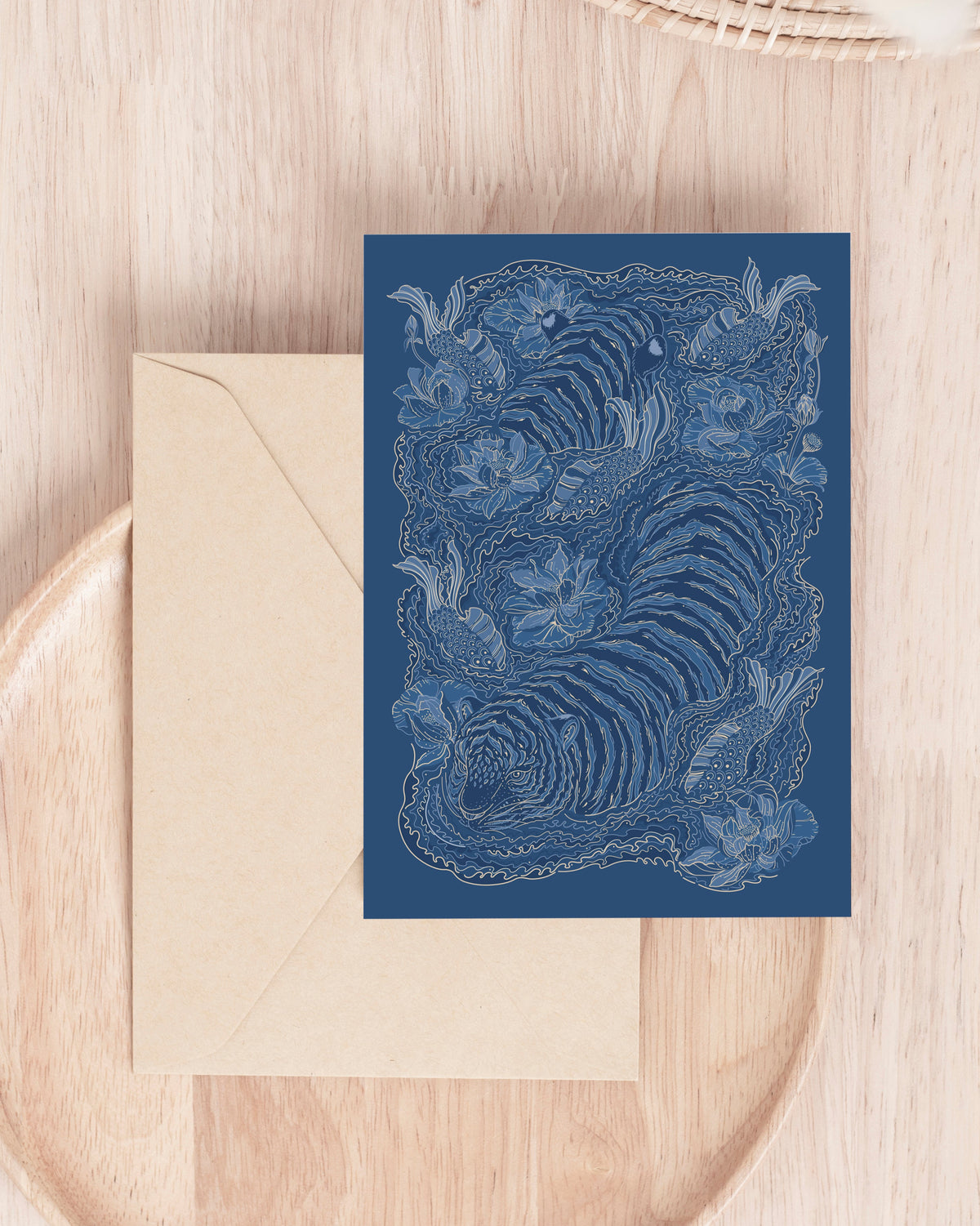 Blue tiger card with intricate design on a wooden surface