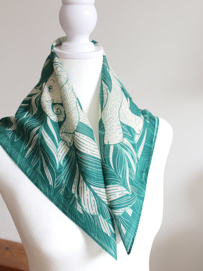 Green Elephant 'Siesta' bandana scarf featuring jungle artwork, perfect for accessories or pet wear.