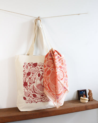 Fox&Berry canvas tote bag with red fox and berry art hanging beside a coordinating scarf, perfect for everyday use.