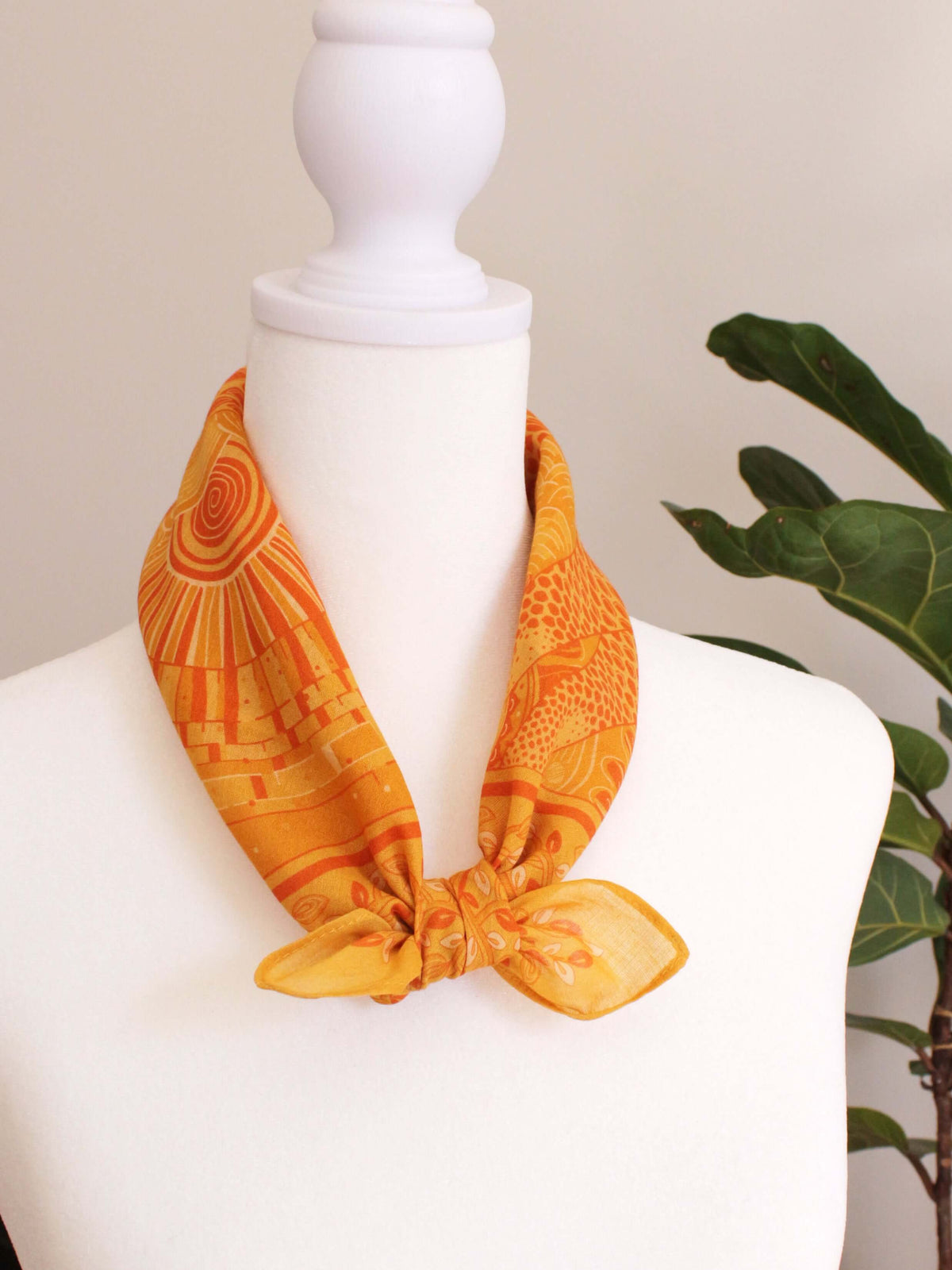 Golden yellow bandana scarf featuring giraffe art, perfect for hair, pets, or fashion accessories.