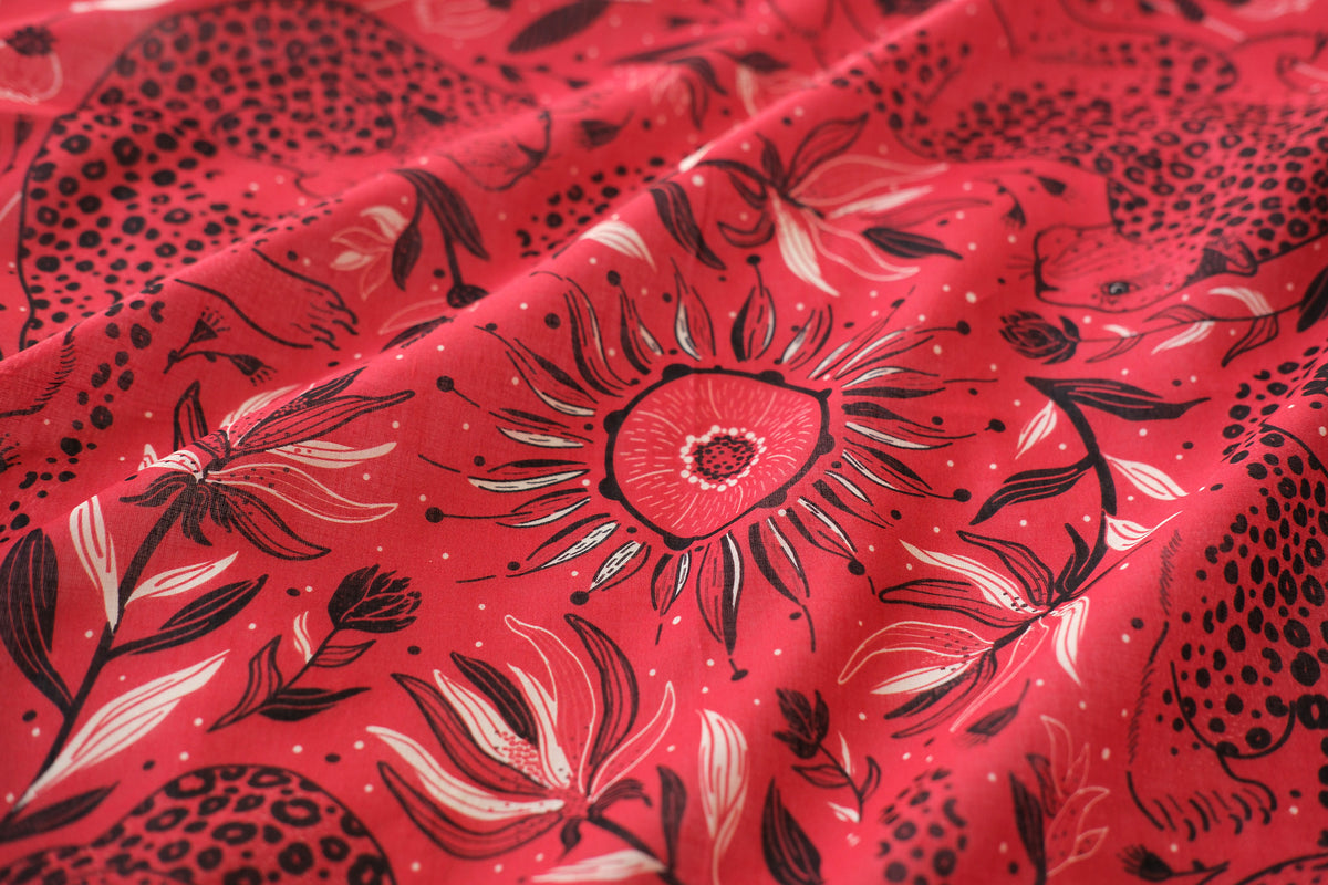 Red fabric with black floral pattern