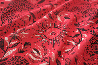 Red fabric with black floral pattern