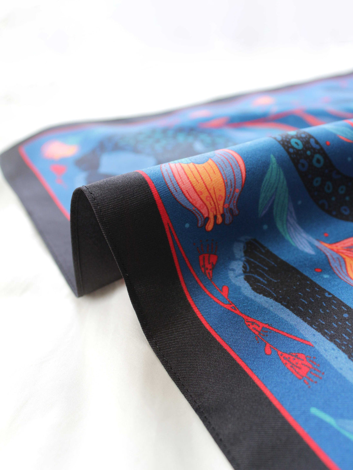 Leopard and the Sun silk twill scarf featuring vibrant tropical designs and a smooth edge.