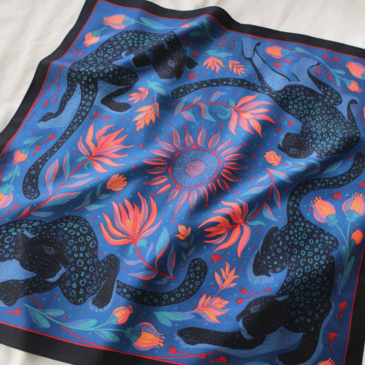 Leopard and the Sun silk twill scarf featuring colorful leopard and tropical flower design, 21"x21" size.