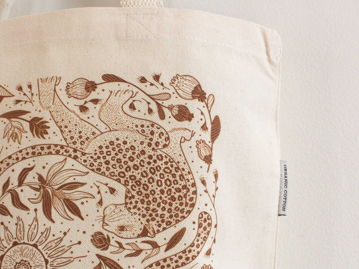 Leopard and Sun line art on organic cotton canvas tote bag, perfect for everyday use and stylish outings.