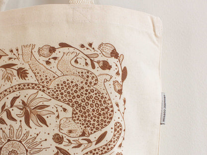 Leopard and Sun line art on organic cotton canvas tote bag, perfect for everyday use and stylish outings.