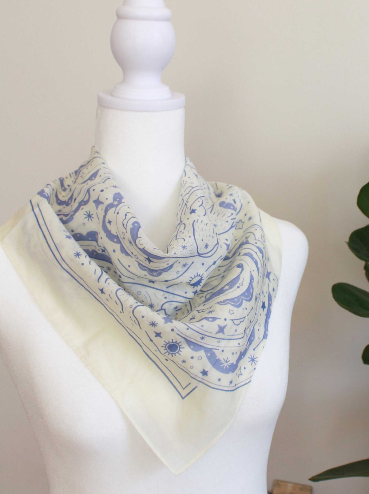Off-white bandana scarf featuring Polar Bear and Northern Sky art, perfect for hair, bags, or pets.