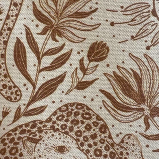 Close-up of Leopard and floral line art design on organic cotton canvas tote bag.