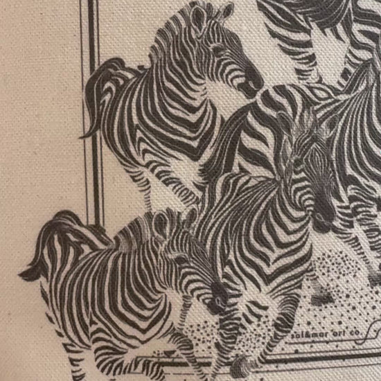Herd of zebras illustrated on canvas, showcasing detailed black and white zebra art for a stylish tote bag.