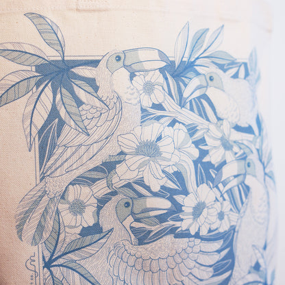 Canvas Tote bag with blue Toucan and floral pattern on beige background