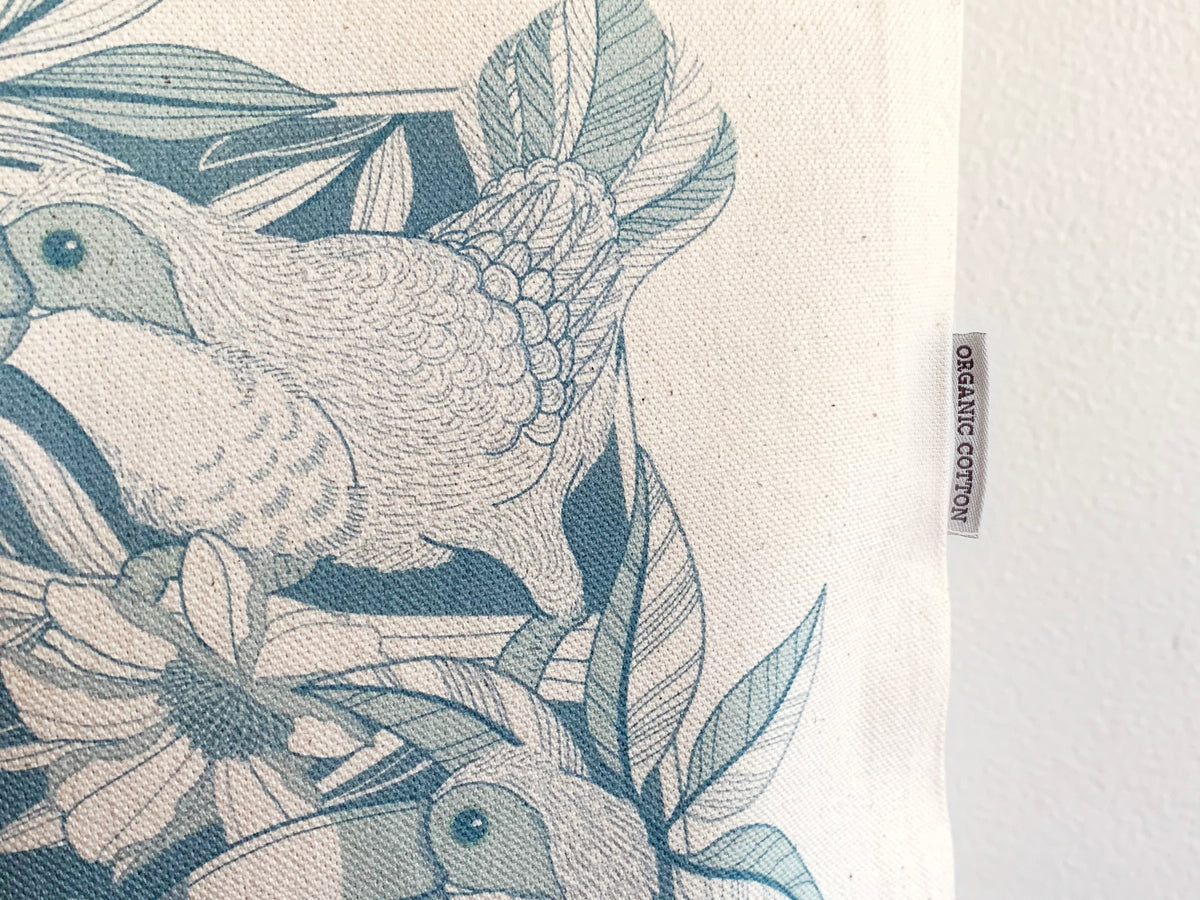 Textile with bird and leaf pattern and organic cotton label