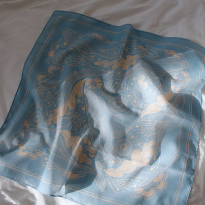 Light blue whale and ocean bandana scarf with artistic design, perfect for hair or pet accessories.