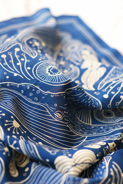 Close-up of Navy Whale and Ocean Bandana Scarf showcasing intricate ocean-themed artwork.