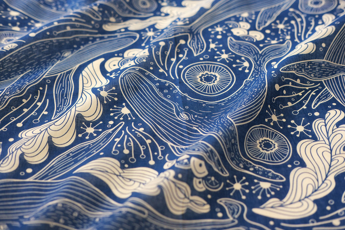 Navy bandana scarf with whale and ocean art design, perfect for accessories and summer wear.