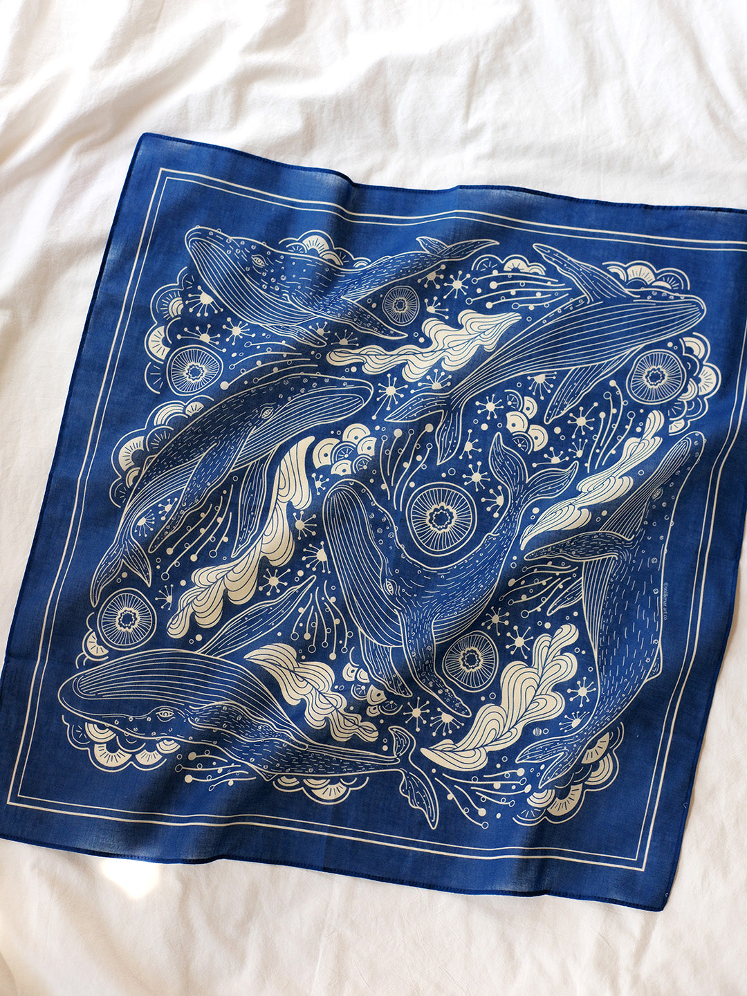 Navy whale bandana scarf featuring Humpback whale art in a decorative pattern, perfect for accessories and decor.