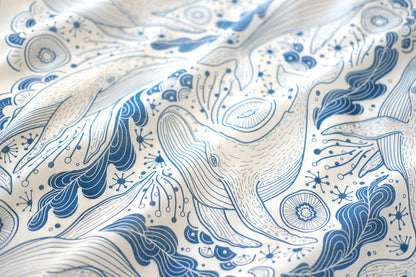 Whale and ocean art design on off-white bandana scarf, featuring humpback whales and ocean waves.
