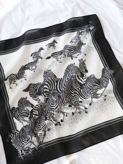 B&W zebra bandana scarf featuring a herd of zebras running, suitable for accessories or pet use.