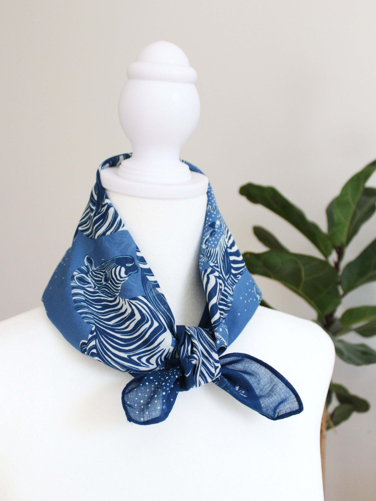 Blue bandana scarf featuring a herd of zebras, perfect for hair or accessory styling.
