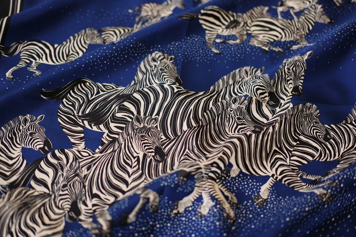 Fabric with zebra pattern on a blue background