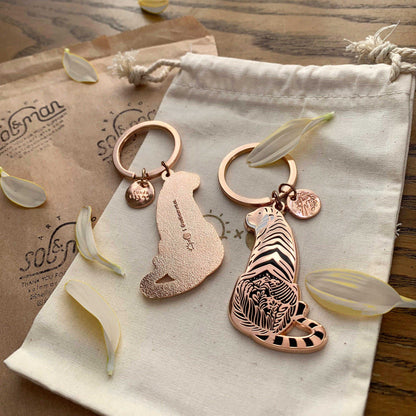 Sunda Tiger enamel keychain featuring delicate artwork and a round tag, supporting endangered animal awareness.